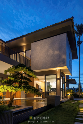 Giải pháp quy hoạch lối đi kết nối nhà mới và nhà cũ tại Hải Phòng, sử dụng đá lát tự nhiên và hệ thống đèn sân vườn ban đêm.